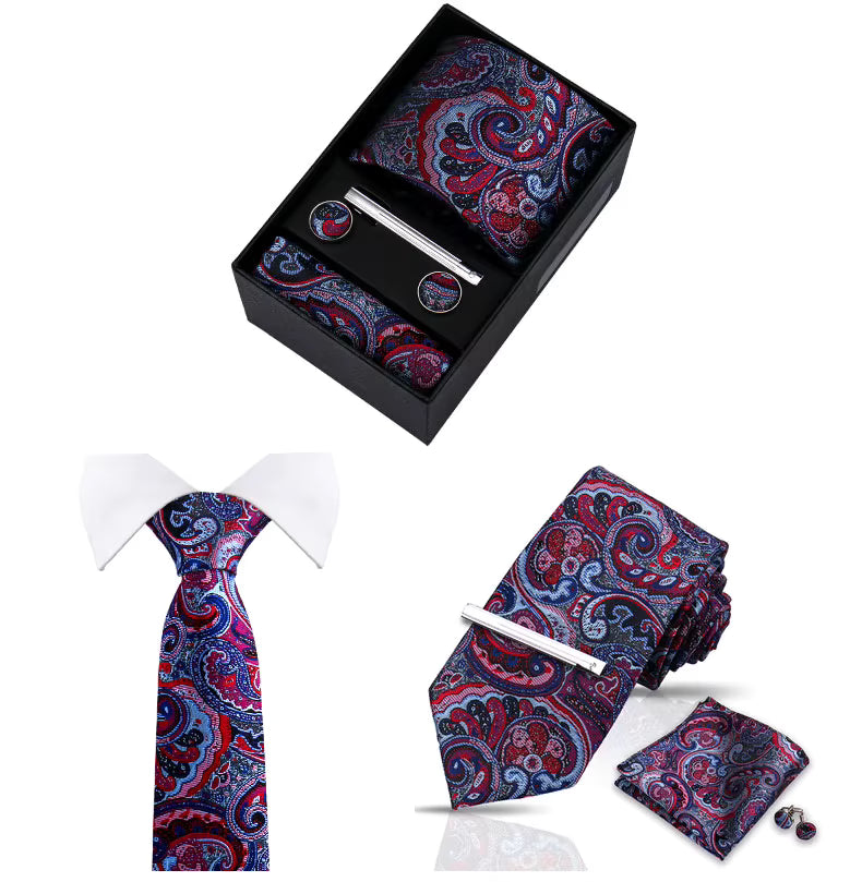 Paisley pattern tie set with tie, pocket square, cufflinks, and box on a white background