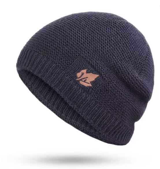 Navy blue knit beanie with a logo on a white background