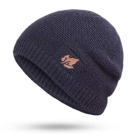 Navy blue knit beanie with a logo on a white background