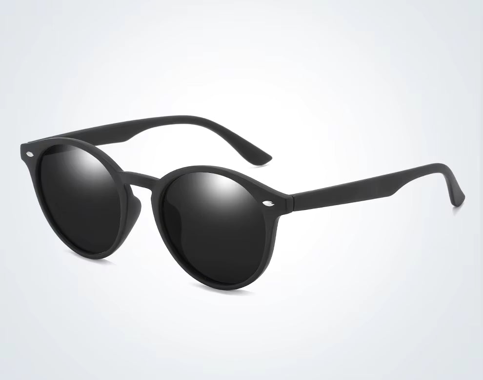 Black sunglasses with reflective lenses on a light gray background