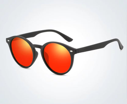 Sunglasses with red lenses and black frames on a white background
