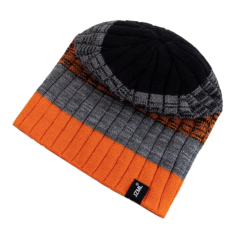 Multicoloured knit beanie with orange, grey, and black sections on a white background