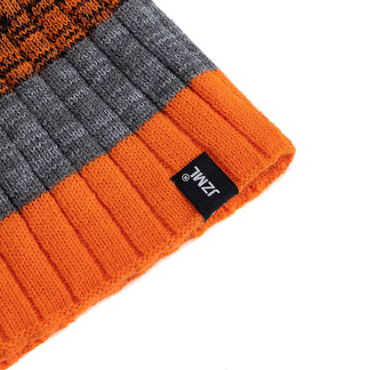 Orange and grey striped knit beanie with a brand label on a white background