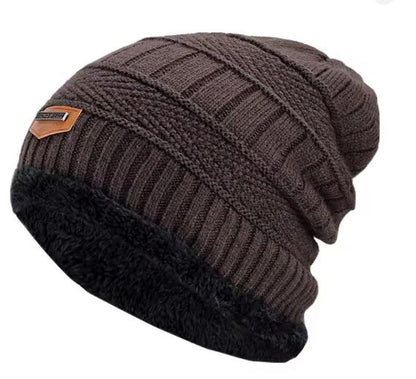Brown knitted beanie with black cuff on a white background