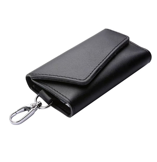Black leather key holder with a keychain on a white background