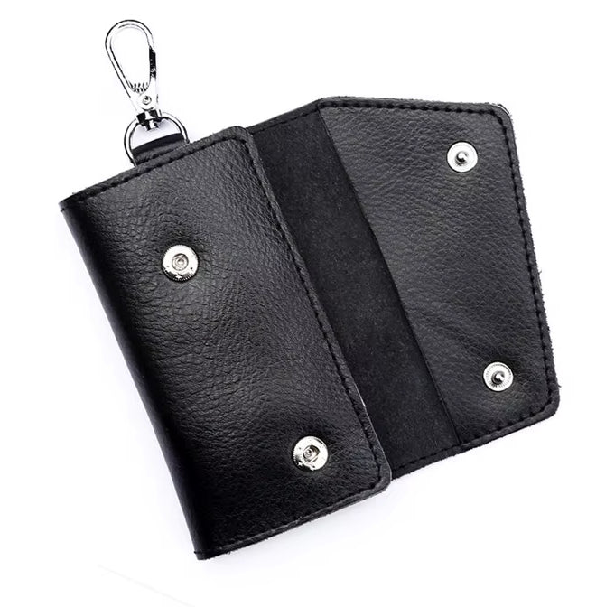 Black leather keychain wallet with metal accents on a white background