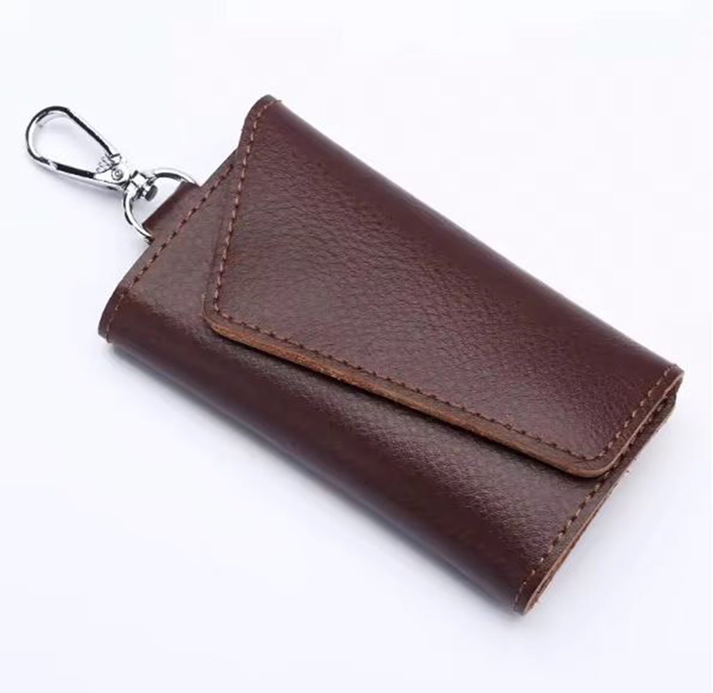 Brown leather key holder with a silver clip on a white background