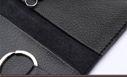 Close-up of black leather keyring with a silver ring on a white background