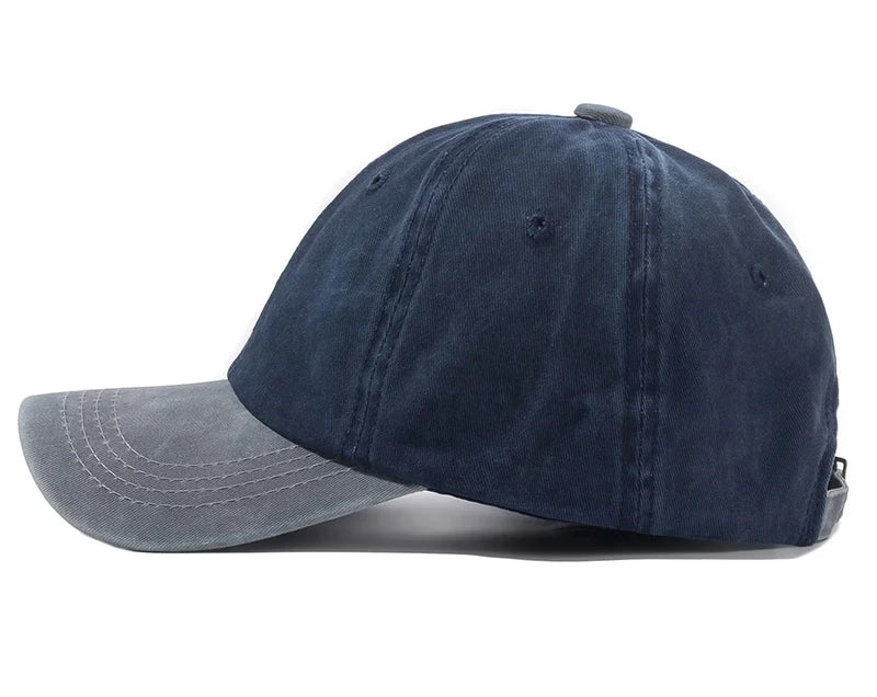 Grey and navy blue baseball cap on a white background