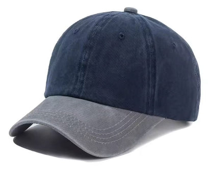 Two-tone grey and navy baseball cap on a white background
