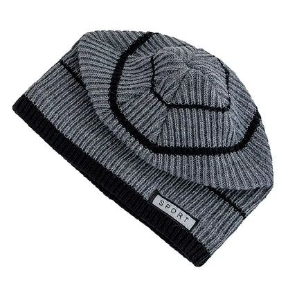 Grey knit beanie with black trim on a white background