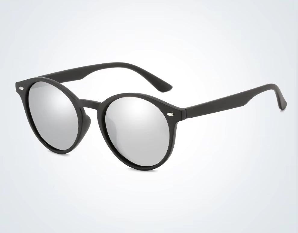 Black round sunglasses with reflective lenses on a light gray background