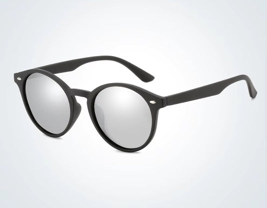 Black round sunglasses with reflective lenses on a light gray background