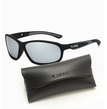 Black sunglasses with silver lenses and a matching case on a white background