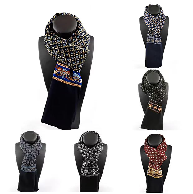 Collection of patterned scarves on black mannequin heads against a white background