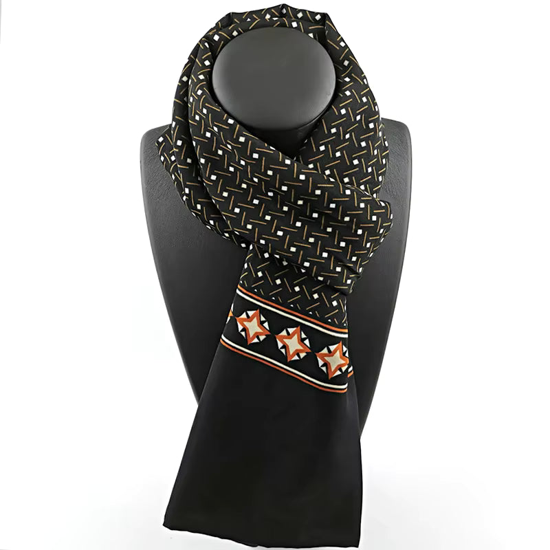 Black scarf with geometric pattern on a mannequin against a white background
