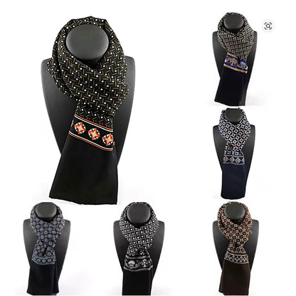 Collection of patterned scarves on black mannequin heads against a white background