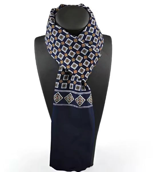 Navy blue scarf with geometric pattern on a black mannequin against a white background