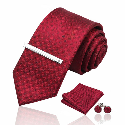 Red patterned tie set with matching pocket square and cufflinks on a white background