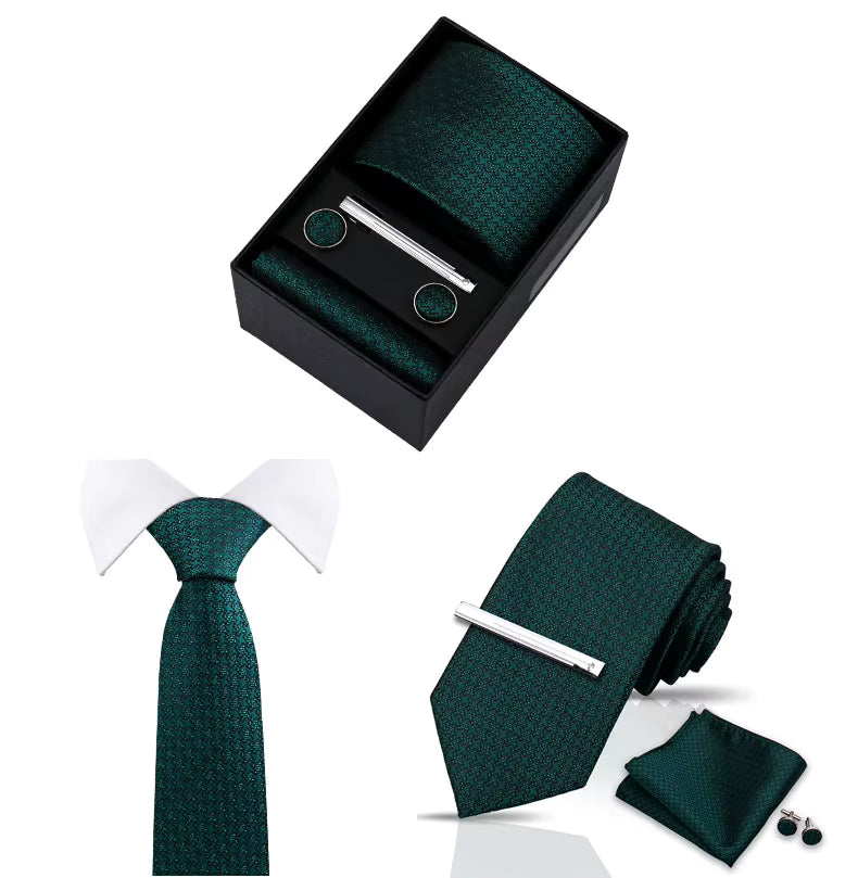 Green tie set with matching pocket square, cufflinks, and tie clip on a white background