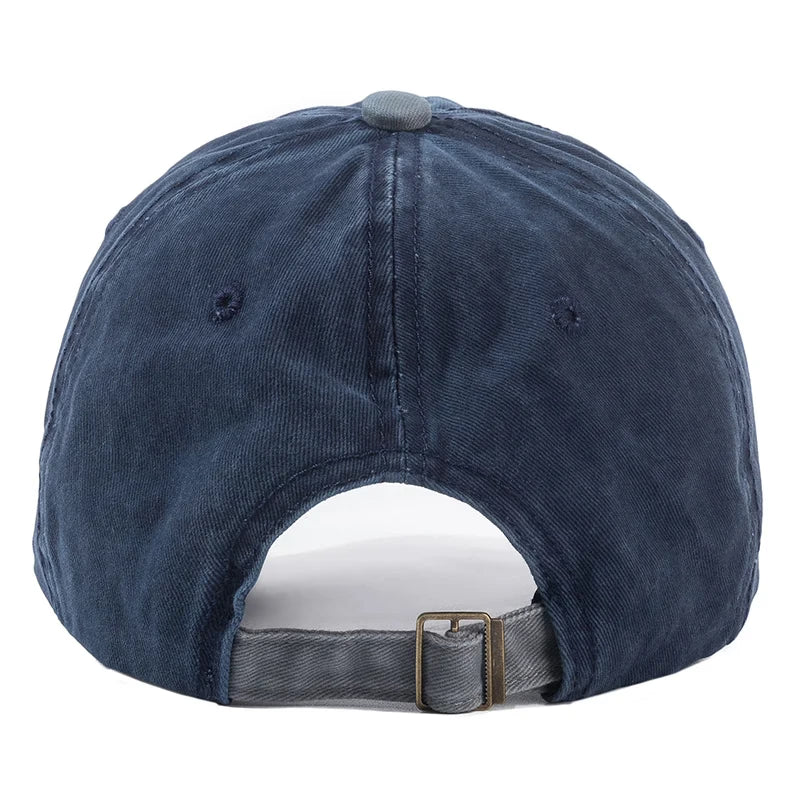 Blue denim cap with a buckle at the back on a white background