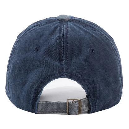 Blue denim cap with a buckle at the back on a white background