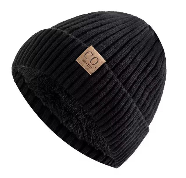 Black ribbed beanie with a brown leather patch on a white background