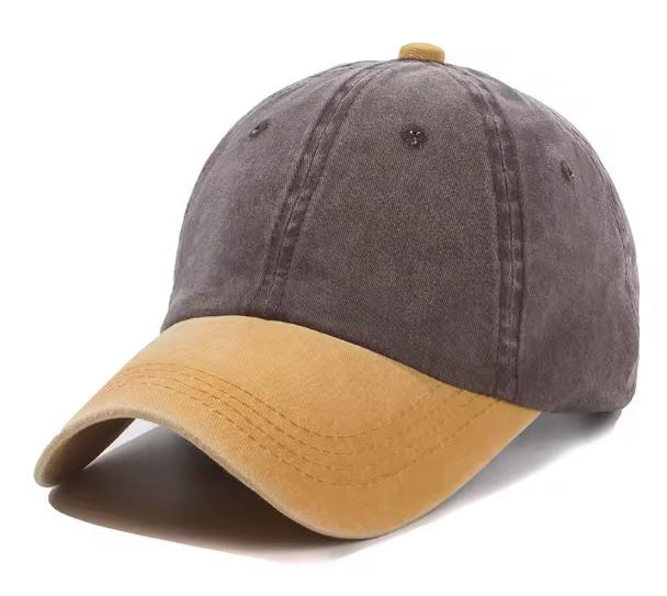 Two-tone cap with coffee coloured top and yellow brim on a white background