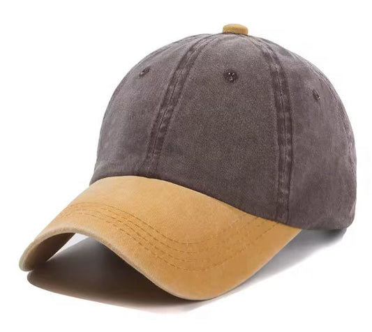Two-tone cap with coffee coloured top and yellow brim on a white background